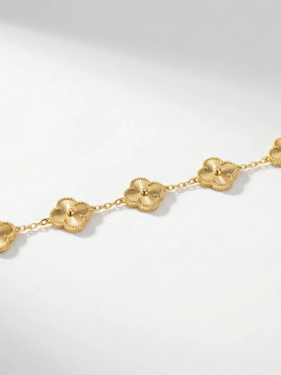 Браслет женский в стиле Van Cleef золотой переливающийся